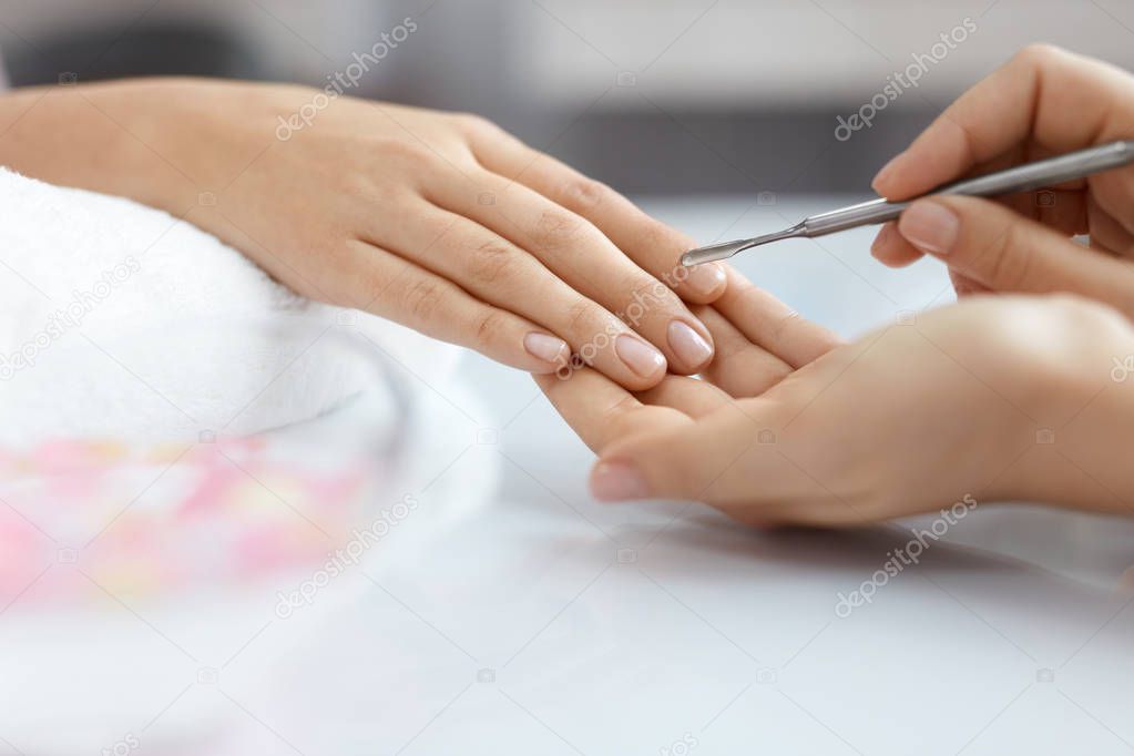 Nail Care. Female Hands Getting Manicure Procedure At Salon