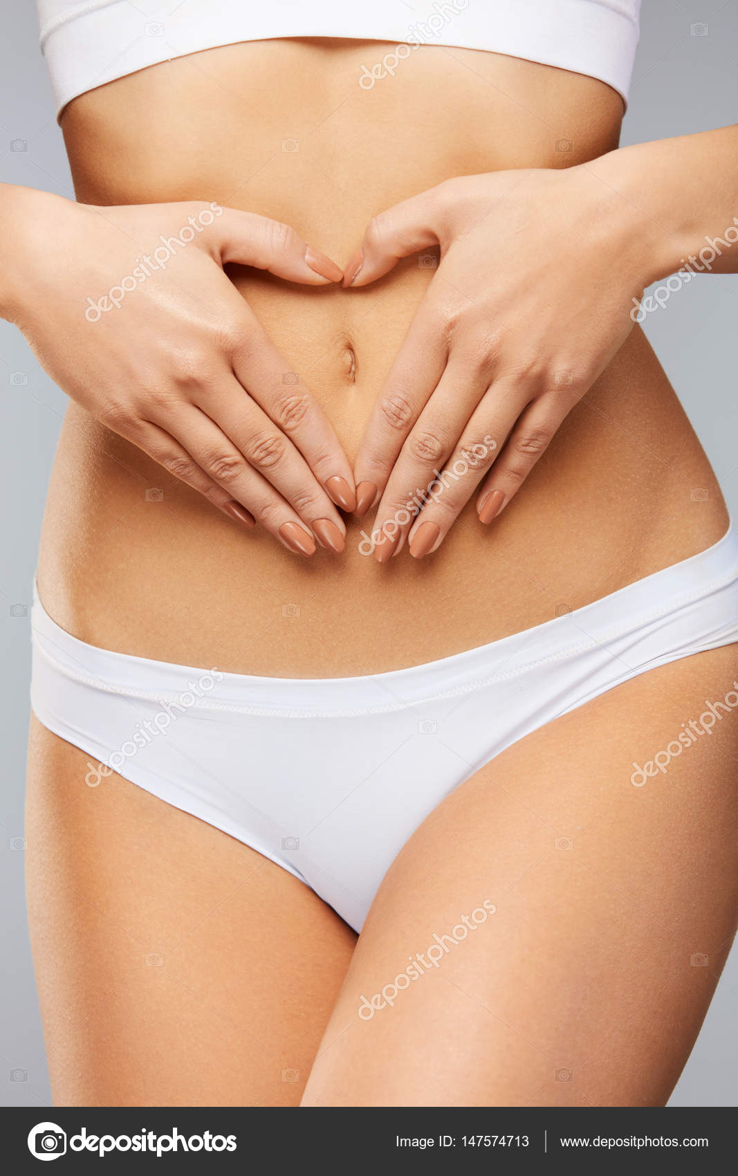 Premium Photo  A woman39s body with folds on the stomach a woman39s hands  hold a saggy stomach high quality photo