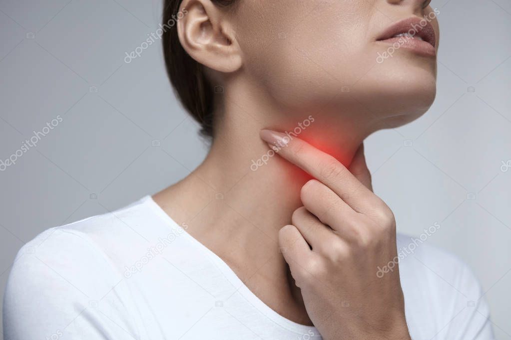 Sore Throat. Closeup Beautiful Woman Hands And Neck. Throat Pain