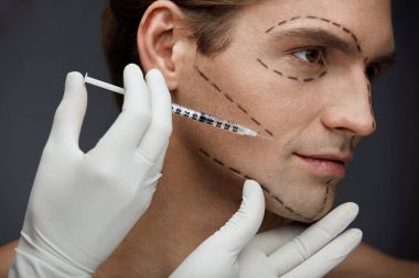 Plastic Surgery. Handsome Man With Face Lines Getting Injections clipart