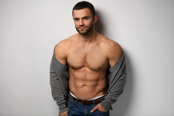 Man Body. Handsome Sexy Male With Muscular Body And Abs Indoors