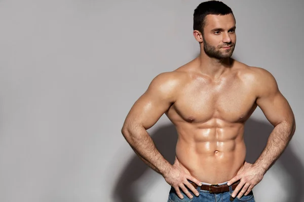 Handsome Smiling Young Man With Sexy Fit Muscular Body Indoors — Stock Photo, Image