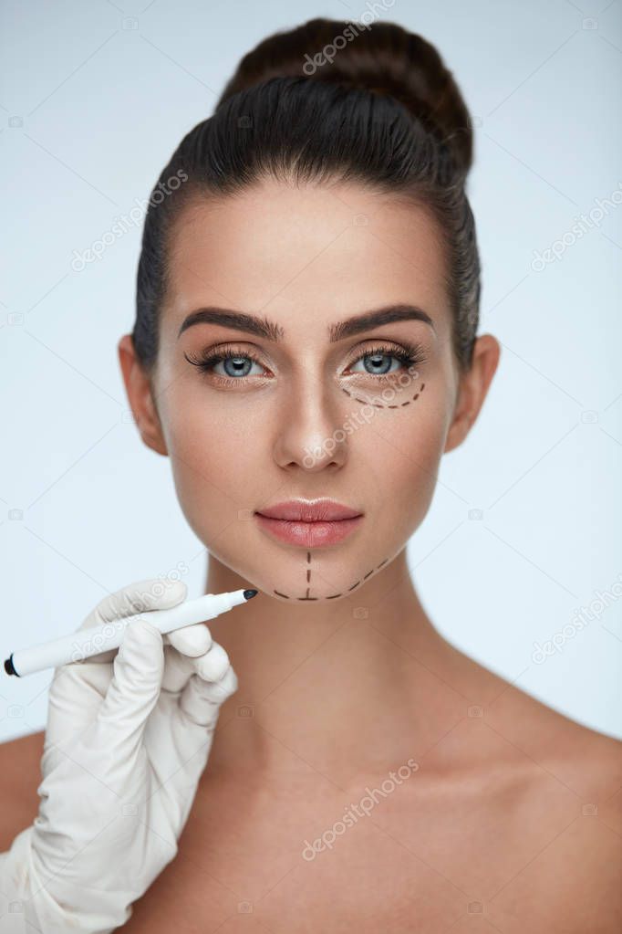 Treatment. Beautician Drawing Surgical Lines On Woman Face