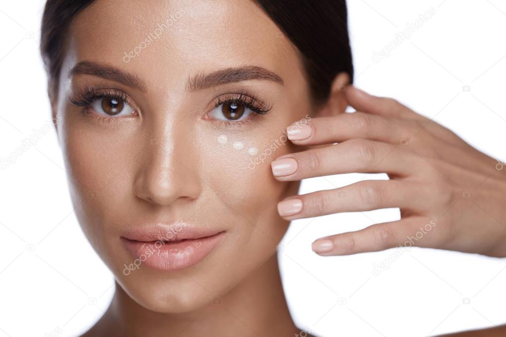 Beauty Cosmetics. Beautiful Woman Face With Concealer Under Eyes