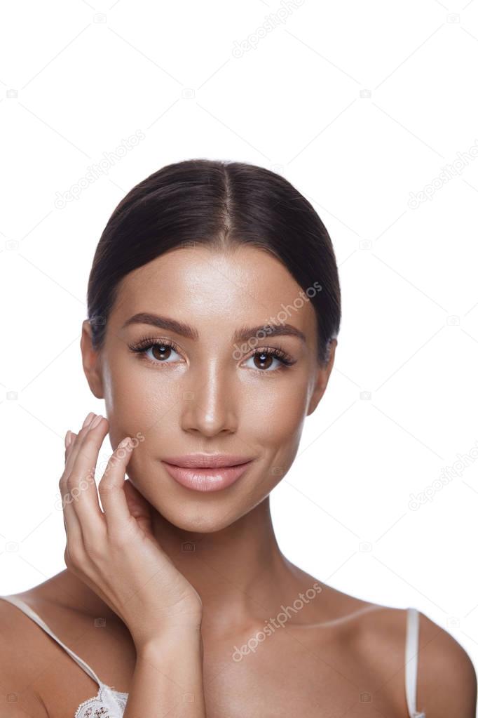 Young Woman With Smooth Soft Skin Touching Face. Skin Care