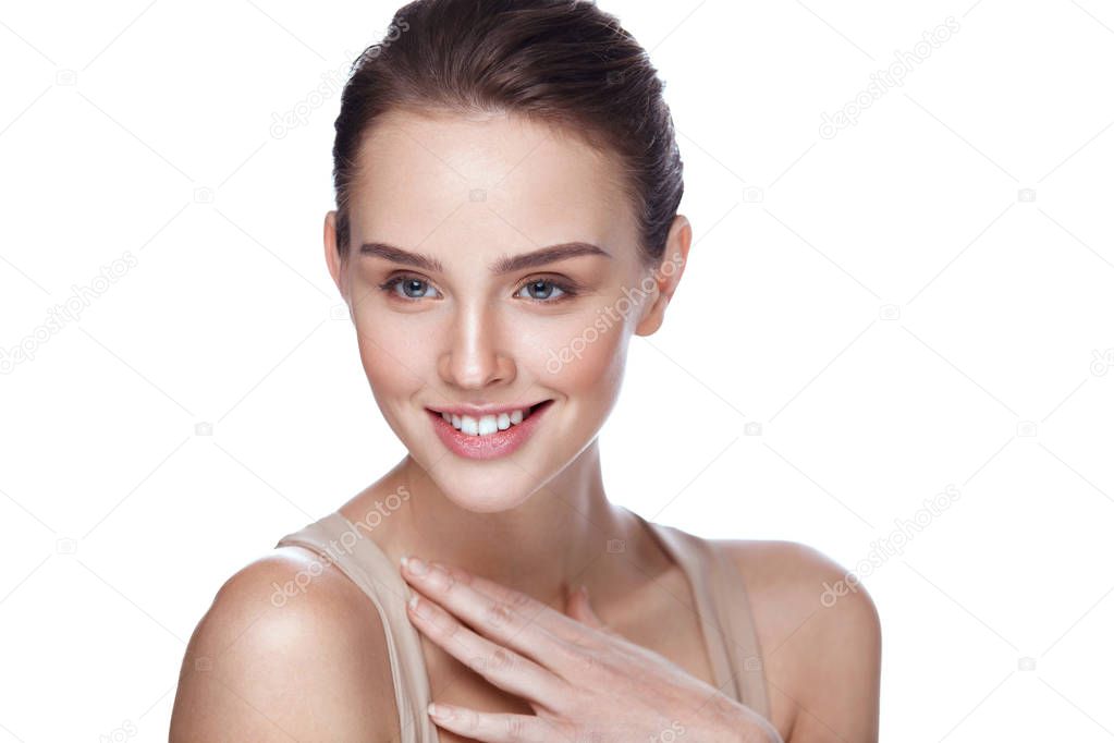 Beauty Cosmetics. Beautiful Smiling Woman Touching Skin