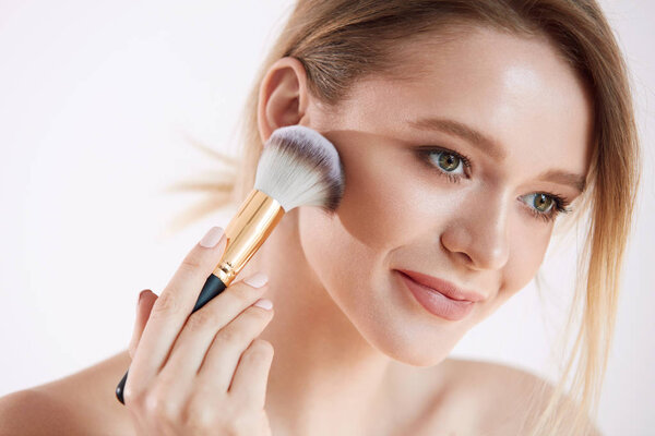 Beauty Face. Portrait Woman With Natural Makeup Applying Powder