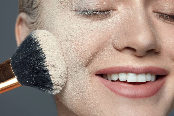 Beauty Makeup. Beautiful Female With Powder On Face And Brush 