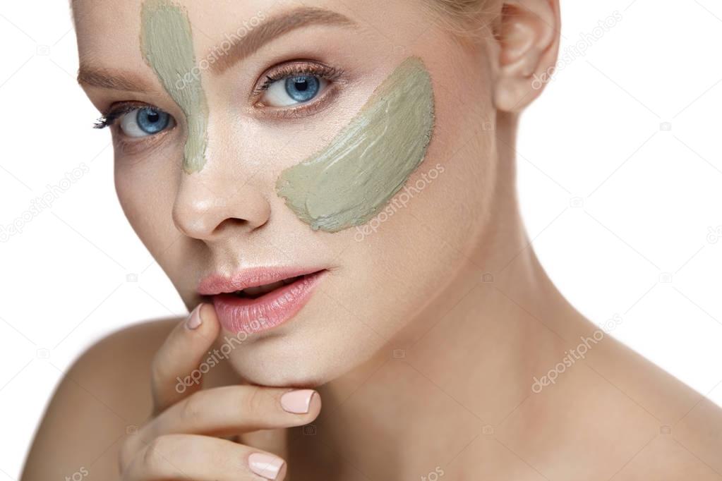 Beauty Cosmetics. Woman With Clay Mask Stripes On Facial Skin