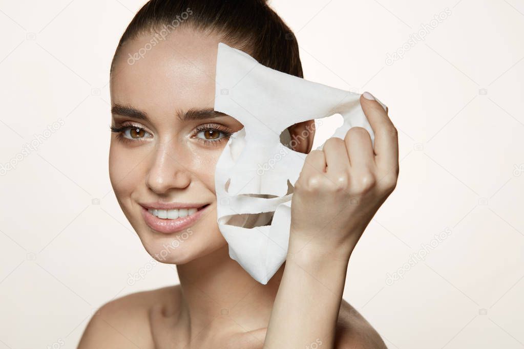 Woman Beauty Face. Young Female Removing Mask From Facial Skin
