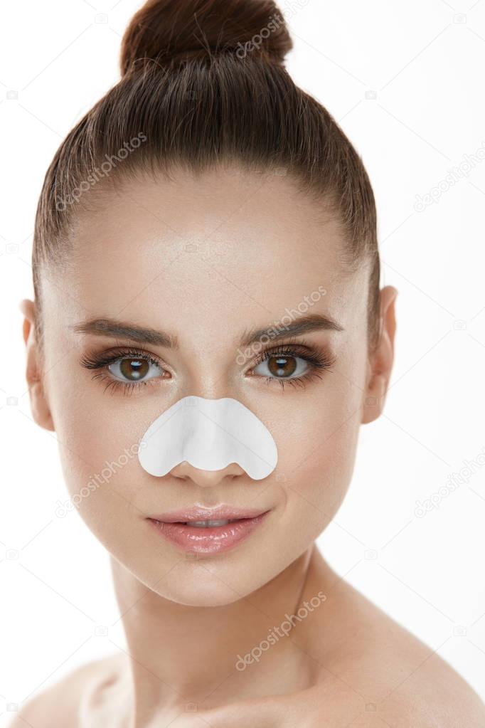 Beautiful Woman Face With Skin Care Patch On Nose