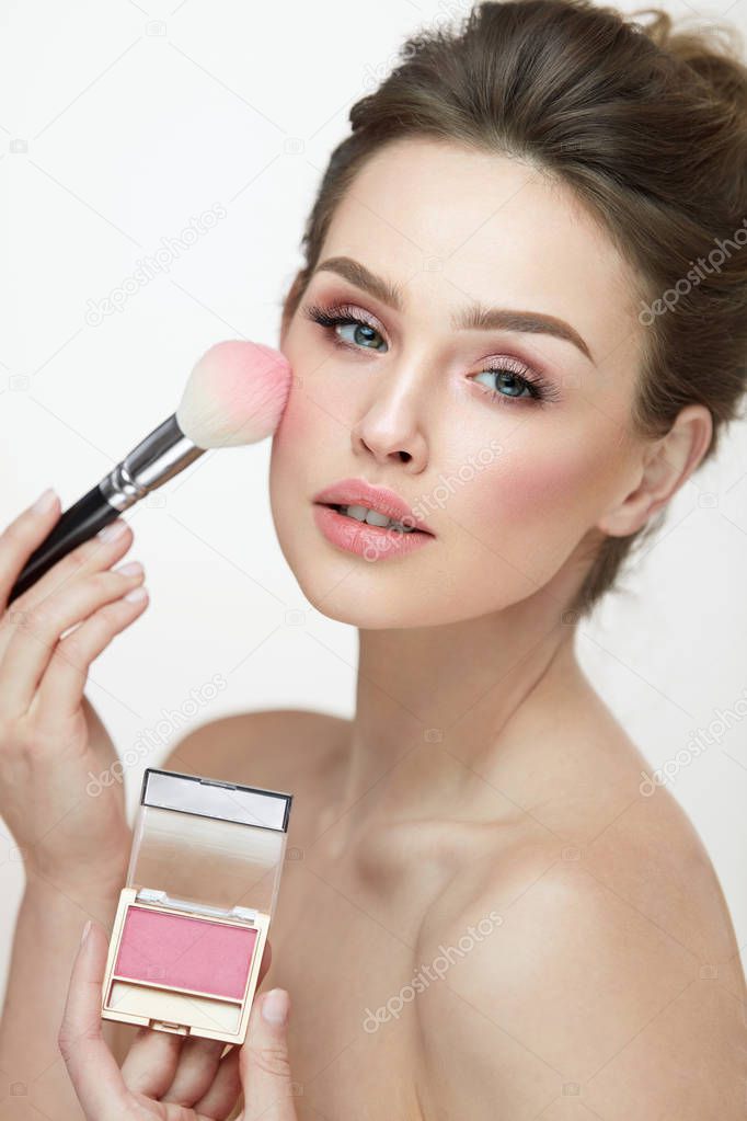 Woman Face Makeup. Close Up Hands Applying Blush On Female Face