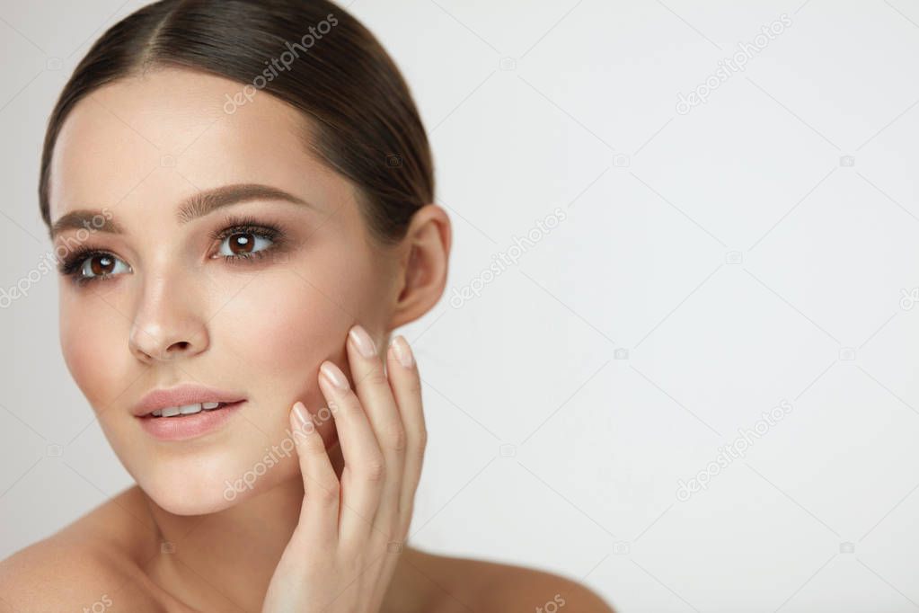 Woman Beauty Face. Female With Natural Makeup Touch Facial Skin