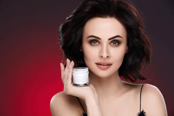 Face Cream. Beautiful Female Model Holding Cream — Stock Photo, Image