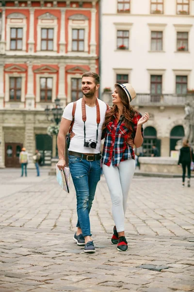 Beautiful Tourist Couple In Love Walking On Street Together.