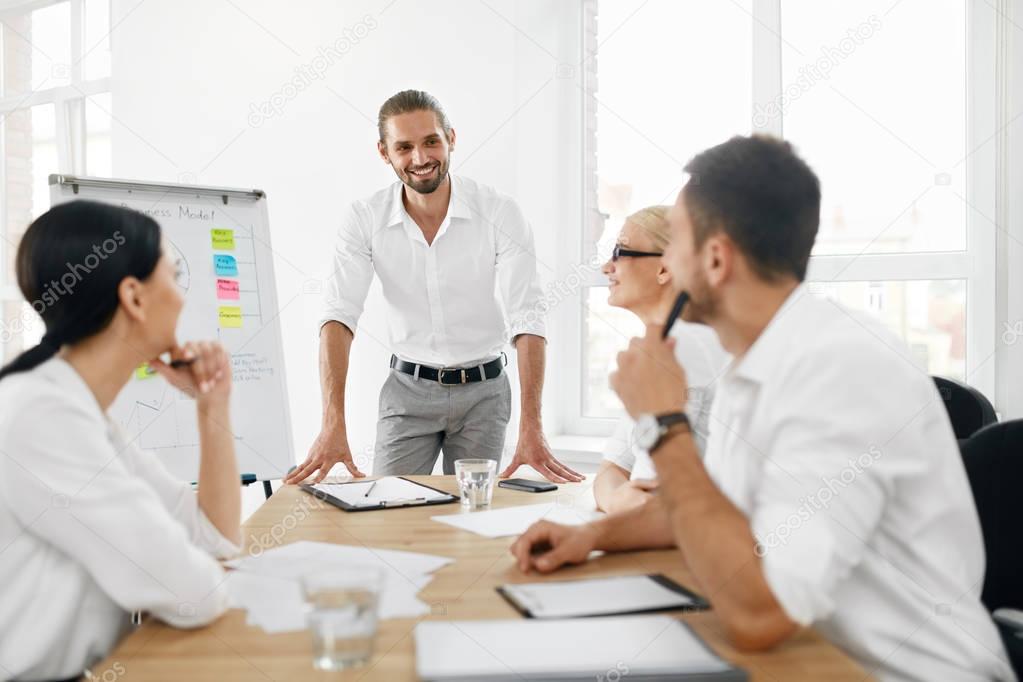 Business Team Meeting. Man Making Presentation In Office