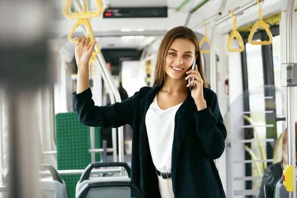 Beautiful Woman Talking On Phone While Going To Work In Bus.