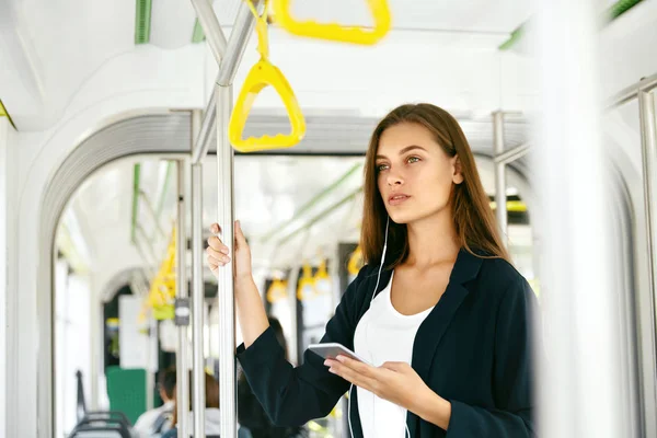 Portrait Of Woman With Phone In Public Transport.