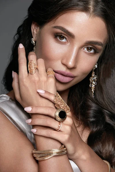 Fashion And Beauty. Woman With Makeup In Jewelry