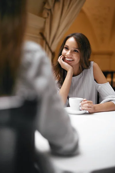 Beautiful Female Friends In Restaurant.