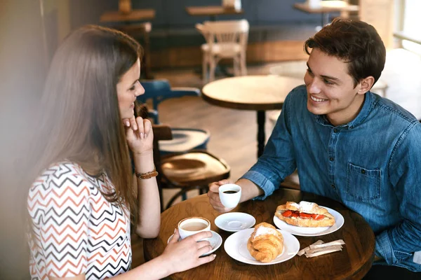 Couple On Romantic Date In Cafe.