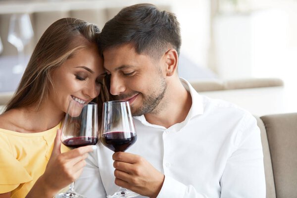 Couple In Love Drinking Wine In Restaurant.