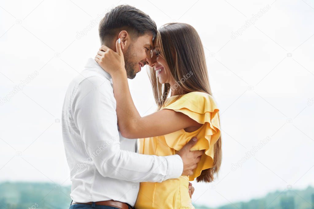 Beautiful Couple In Love Embracing Outdoors