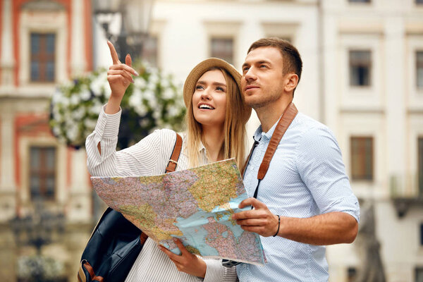 Couple With Map On Travel Vacations, Sightseeing