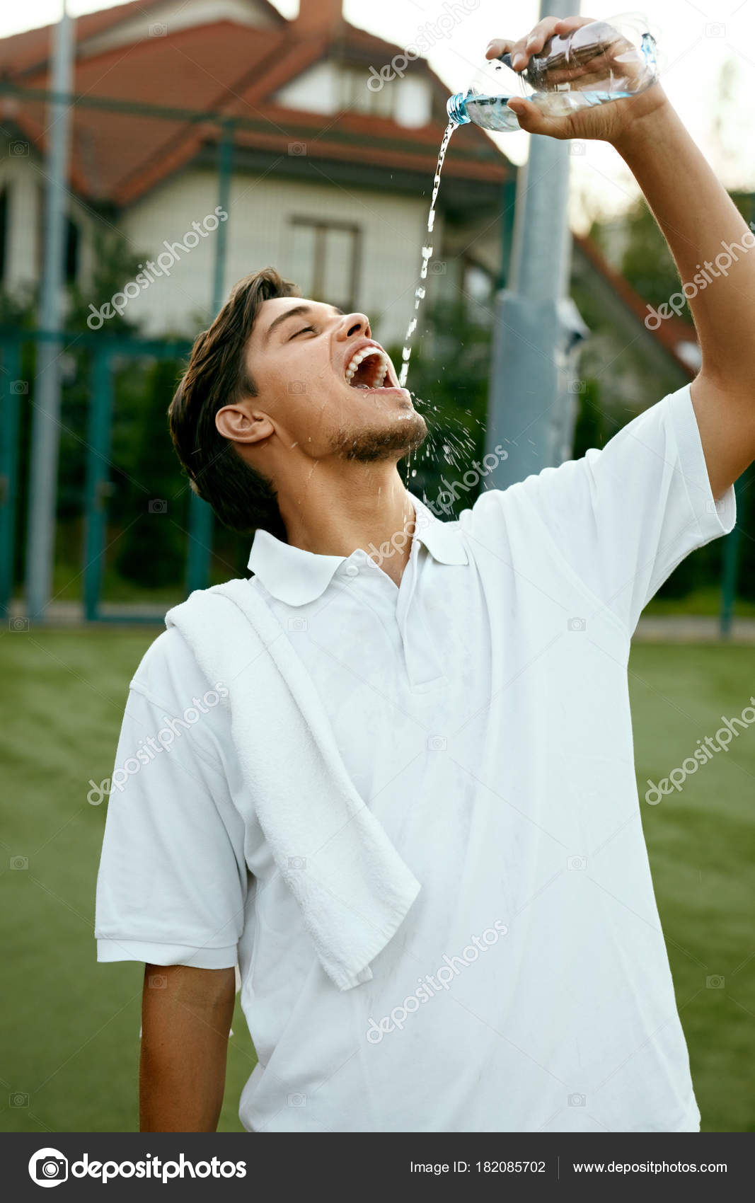 Man Drinking Water After Exercising — Stock Photo © puhhha #182085702, image size:1067x1700