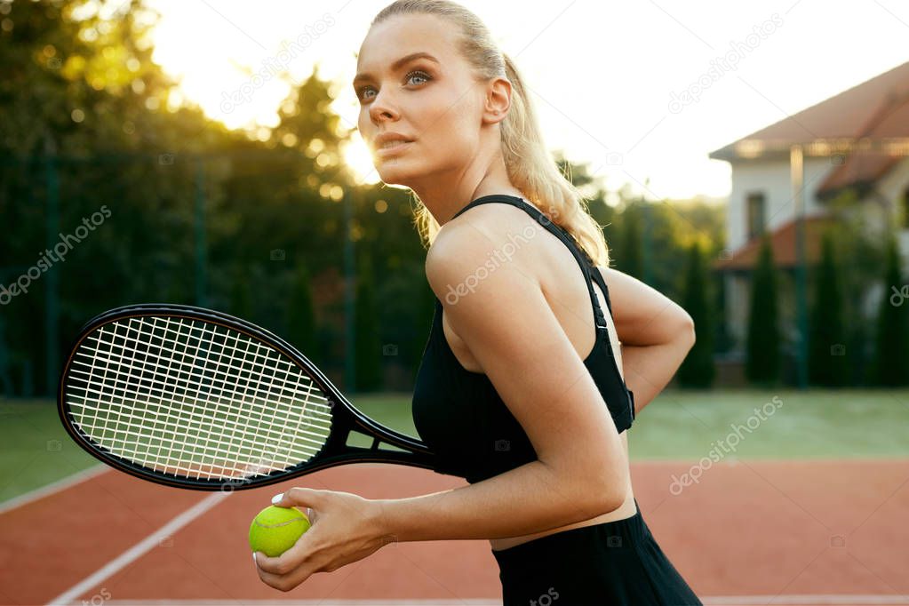 Sports Fashion. Beautiful Woman On Tennis Court.