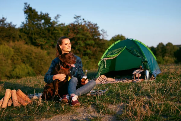 Happy Woman Traveling With Dog On Weekend In Nature.