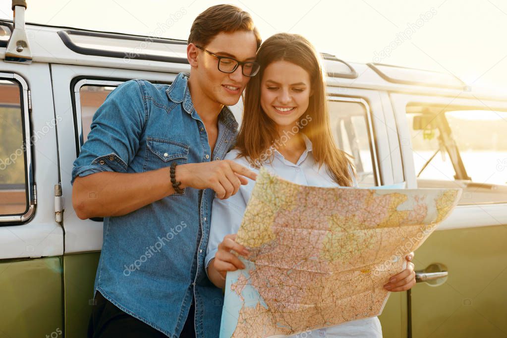 Tourist Couple With Map Near Car.