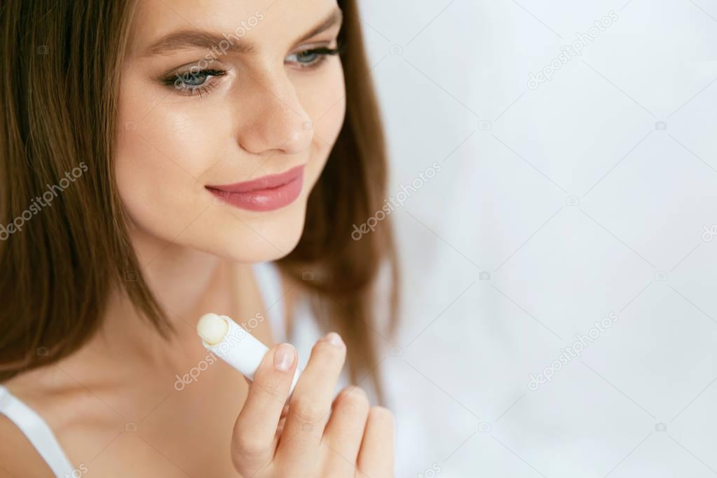 Lips Skin Care. Woman With Hygienic Lip Balm.