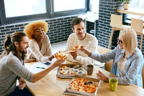 Friends Eating Food In Cafe. People Eating Pizza