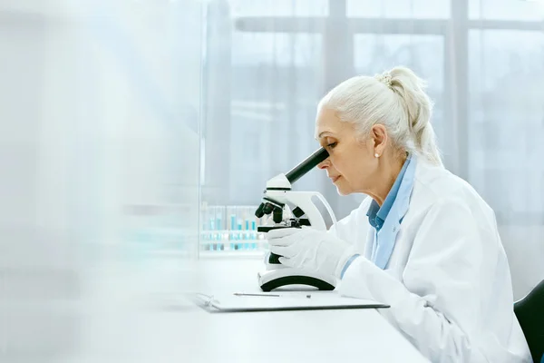 Clinical Test. Female Scientist Working In Laboratory.