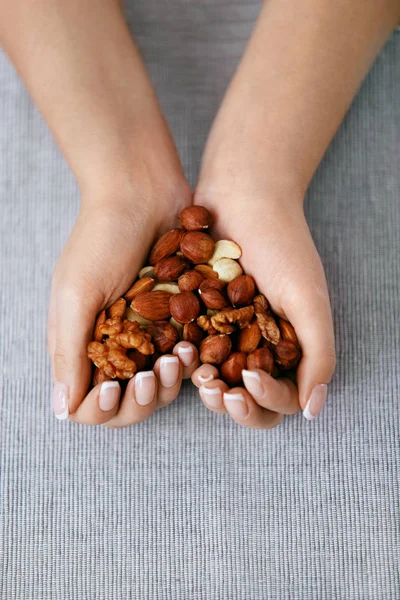 Nuts Heart. Hands Holding Different Nuts