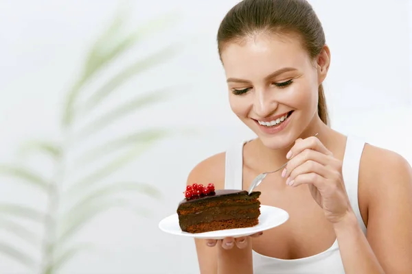 Woman Eating Cake. Beautiful Female Eating Dessert