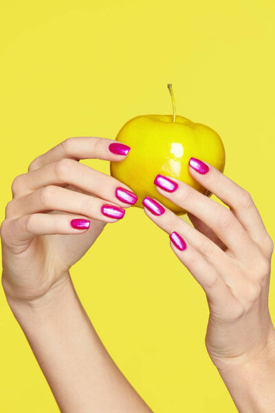 Nails Design. Female Hands With Colorful Nails Holding Apple