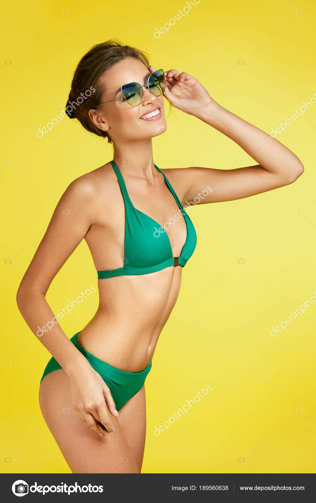Sexy Woman In Swimsuit And Sunglasses. Stock Photo by ©puhhha