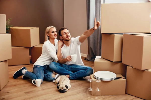 Young Couple Planning Moving In New Apartment