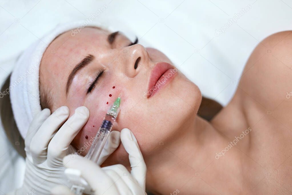 Face Treatment. Beauty Injection Near Eyes. Female Skincare  Procedure In Cosmetic Clinic. Beautician Hands In Gloves With Syringe.