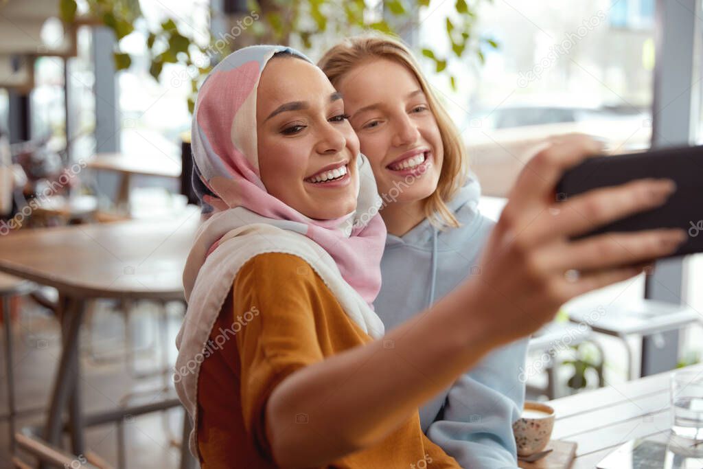 Friends. Young Girls Taking Selfie. Women Meeting In Cafe. Smiling Female Spending Time In Bistro. 