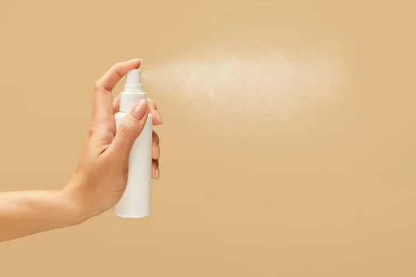 Hygiene. Hand Spraying Antiseptic On Beige Background. Using Sanitizer For Virus Prevention And Staying Healthy.