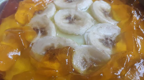 Creamy tasty sweet custard with banana pieces layered on surface — Stock Photo, Image