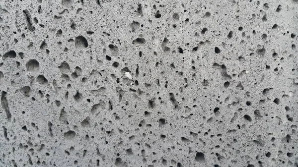 Grey color floor background with drak grey hole shapes