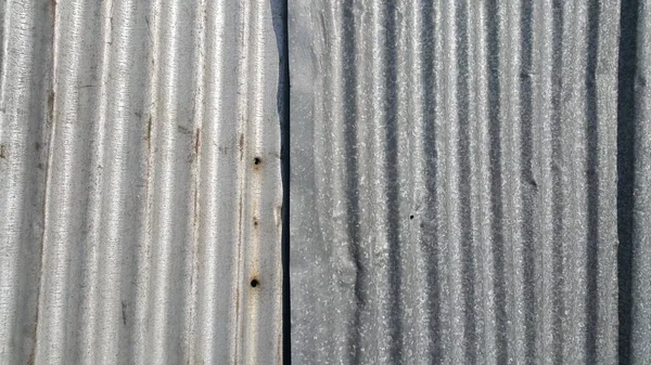 Silver corrugated metal sheet texture background