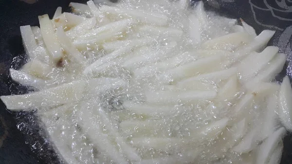 Closeup view of uncooked potato french fries or potato sticks — Stock Photo, Image