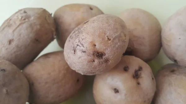 Close-up beeld van verse biologische aardappel in de markt: aardappelen achtergrond textuur — Stockfoto