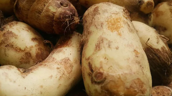 Closeup view of taro vegetable pile for sale in market