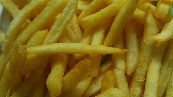 Vue rapprochée des frites de pommes de terre ou des tranches rôties — Photo